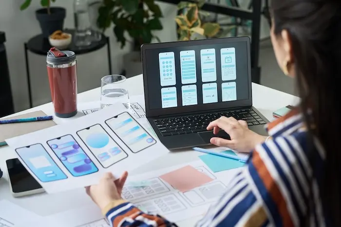 A young woman working in a technology job for adults with autism