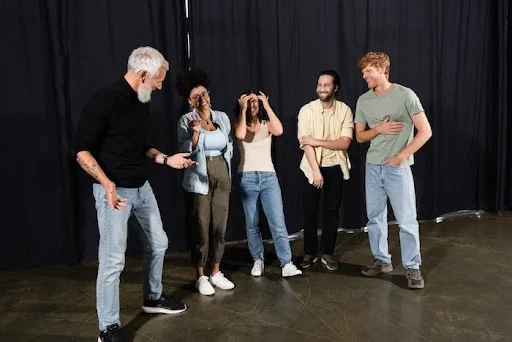 Young adults in an improv workshop for autistic adults